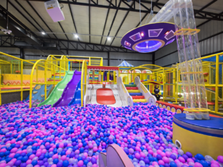 colorful play zone with slides and ball pit