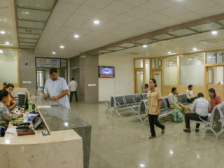 hospital waiting area with staff and patients
