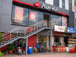 pizza hut storefront in urban setting